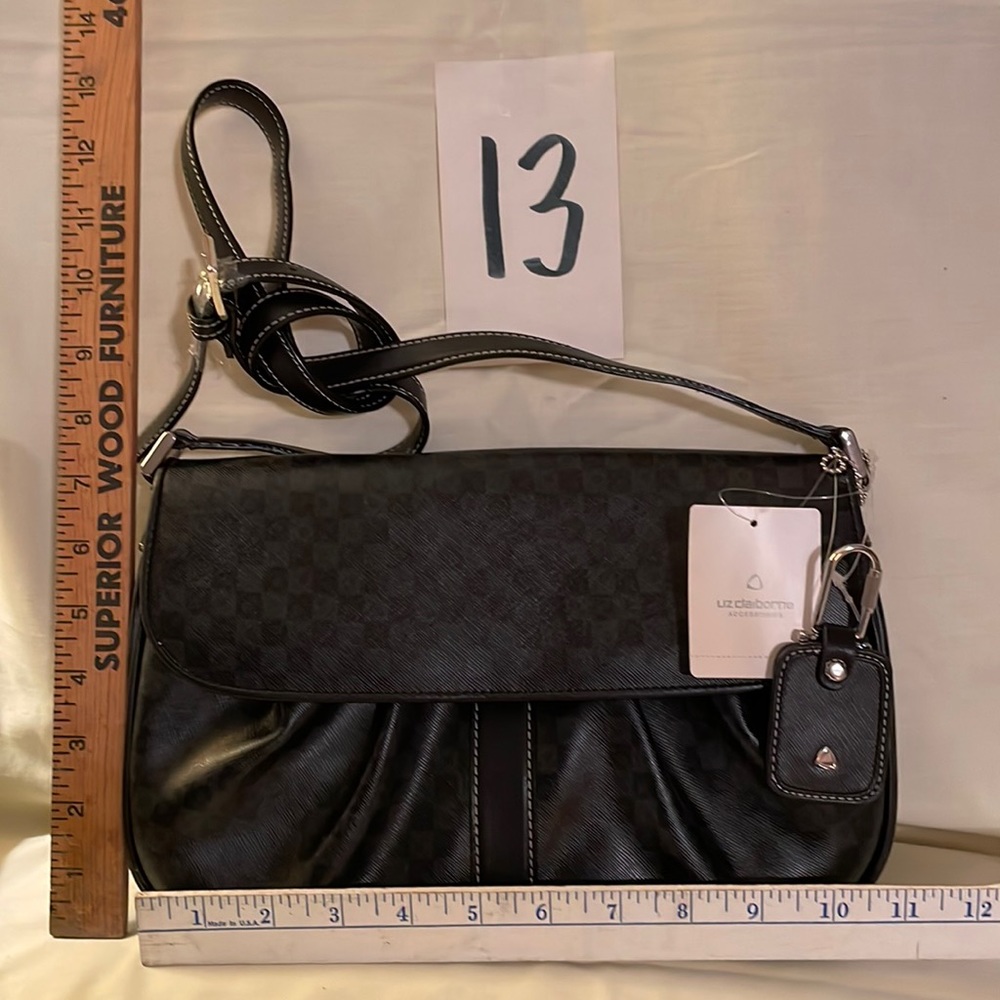 Brand New Liz Claiborne black handbag with tags. Mirror and key fob included.